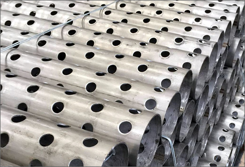 Perforated tubing for candle filters manufacturing